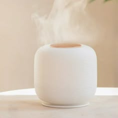 a white diffuser sitting on top of a table