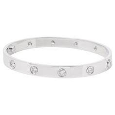 Cartier 10 Diamond 18ct White Gold Love Bangle Brand- Cartier Model- 10 Diamond Love Bangle Product Type- Bracelet Serial Number- M5**** Accompanied By- Cartier Pouch, Service Papers, Care Kit, Screwdriver Material(s)- 18ct White Gold Gemstone- Diamond Gemstone Quantity- 10 Gemstone Cut- Round Brilliant Gemstone Carat Weight- 0.96ct Bracelet Length- 17cm Bracelet Width- 5.8mm Total Weight- 32.1g Model Number- B6070417 Condition Rating- Excellent Condition Notes- An item rated as excellent exhibi Modern Bangle, Paper Bracelet, Modern Bracelets, Cartier Love, Diamond Bangle, Stone Cuts, Dream Jewelry, Diamond Gemstone, Modern Jewelry