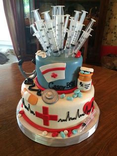 a cake decorated with medical equipment on top of a table