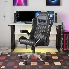 an office chair sitting in front of a computer desk