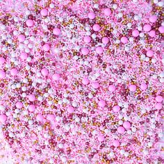 pink and white sprinkles are mixed together in this abstract art work,