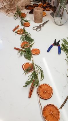 the table is decorated with pine and cinnamon slices