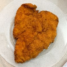 a piece of fried chicken on a white plate