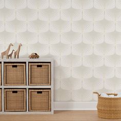 a toy giraffe is sitting on top of a shelf next to some baskets