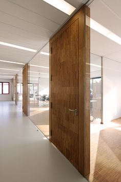 an open wooden door in the middle of a room