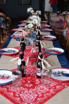 the table is set with red, white and blue place settings