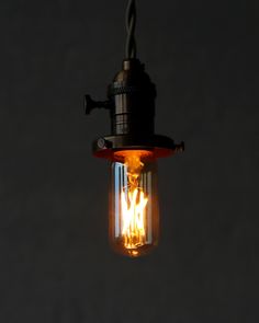 a light bulb that is lit up in the dark