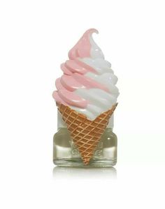 an ice cream cone with pink and white icing in a small glass bottle on a white background