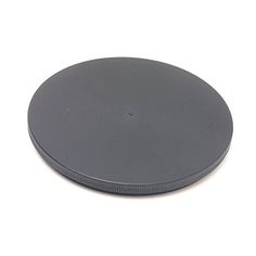 a black round object sitting on top of a white surface