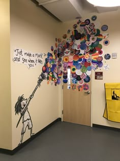 an office hallway decorated with buttons and magnets