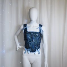 This delicate corset was created for a modern-day fairy princess to help to evoke the magical spirit of your own personal fairy tale. This corset is made from second hand store jeans and cotton flowery shirt. We seek to reduce textile waste and pollution by creating something new from  unusable clothes that end up in a landfill. This corset features: -Corset has back lacing (~2 m of satin ribbon) -The bows on the shoulders can be re-tied to fit perfectly -Corset is fully lined with flower cotton Princess Corset, Korsett Top, Medieval Corset, Store Jeans, Lace Corset Top, La Pollution, Blue Corset, Corset Bustier, Second Hand Stores