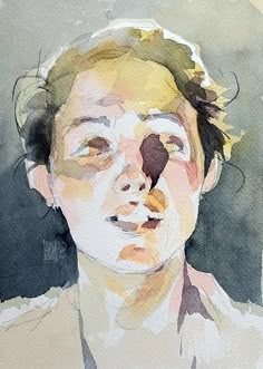 a watercolor painting of a woman's face