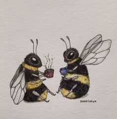 two bees sitting next to each other drinking coffee