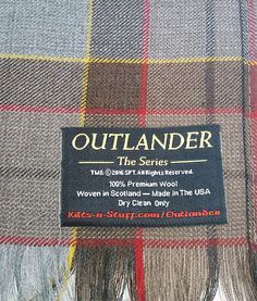 a plaid blanket with an outlander label on it