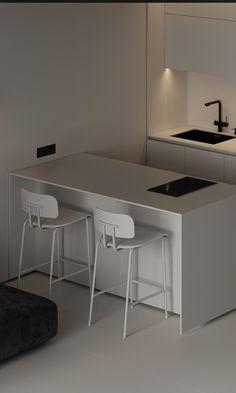 a modern kitchen with an island counter and stools