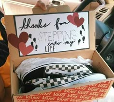 someone is holding up a box with shoes inside it that says thanks for stepping into my life