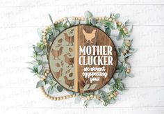 a wooden sign with the words mother clucker and an image of chickens on it