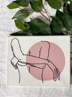 a pink circle with a drawing of a woman's hand holding a man's arm