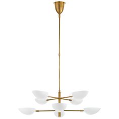 a brass chandelier with five white glass shades