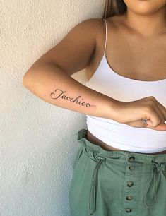 a woman with a tattoo on her arm