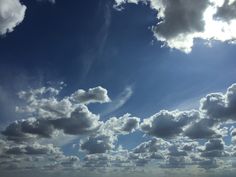 the sun shines brightly through clouds over an ocean