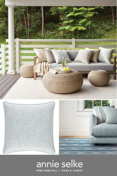 an outdoor living room with blue and white furniture on the front porch, and in the background are pine trees