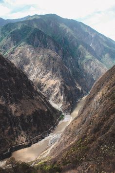 there is a river in the middle of mountains