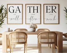 a dining room table with chairs and two posters on the wall above it that say gather, laugh, laugh