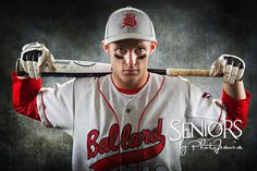 a baseball player is holding a bat over his head and posing for the camera with it's hands behind his head