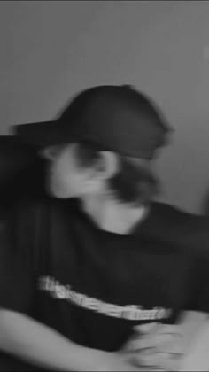 a blurry photo of a person wearing a hat