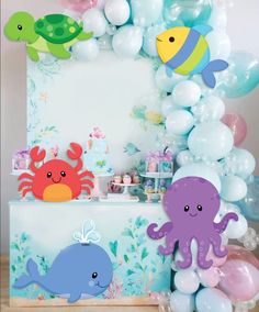 an ocean themed birthday party with balloons and decorations