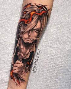 a man's arm with an anime character on it and flames coming out of his eyes