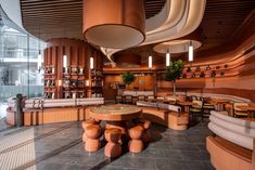 the interior of a restaurant with tables and chairs