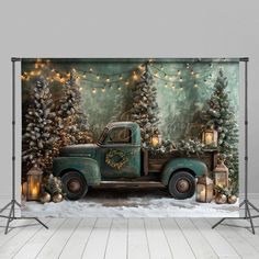 an old truck is decorated with christmas lights and garlands in front of a backdrop