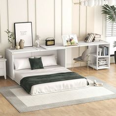 a bedroom with white walls and wooden floors