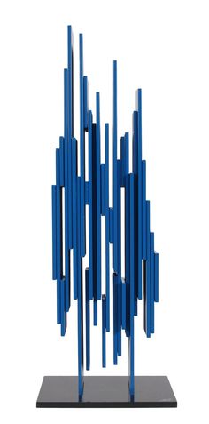 a blue sculpture is sitting on a black stand and it looks like it has been made out of metal rods