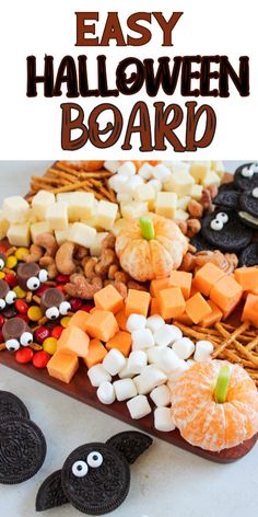 an easy halloween board made out of cookies and candy