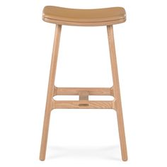 a wooden stool with a tan leather seat