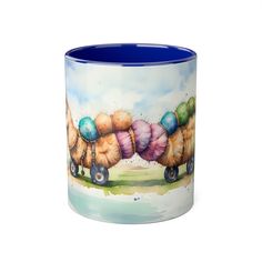 a blue and white coffee mug with an image of shells on the inside of it