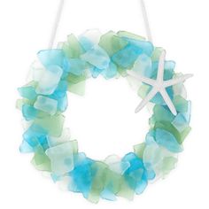 PRICES MAY VARY. 【Handmade Sea Glass Garland】Elevate your home decor with our exquisite Sea Glass Wreath. Handcrafted with care, this 8 inch wreath embodies coastal charm and natural beauty. 【Versatile Decorating】This wreath is perfect for all seasons. Hang it on your kitchen cabinets, front door, window, chair, or walls and more to add a touch of coastal style to your home. 【Unique Artistry】The unique patterns and colors of sea glass sheets ensure that no two wreaths are exactly alike, making i