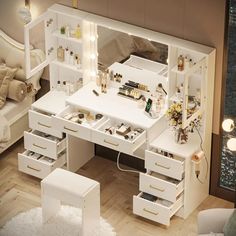 a white desk with lots of drawers and lights on it in a room next to a bed