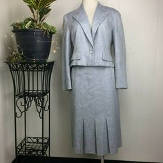 Knit blue and white blazer and skirt suit set. I believe it is a wool blend. No brand or tags. Both are fully lined. Blazer: Single button Faux pocket Cropped Notched collar Measurements (flat): Shoulder to shoulder: 16.5" Armpit to armpit: 19" Waist: 16" Bottom hem: 18" Length: 18" Sleeve: 22" Skirt: Pencil Pleated Pockets Measurements (flat): Waist: 12.5" Hips: 17" Bottom hem: 23.5" Length: 27" Approximately a size XS, please see measurements. Good condition. White Two Piece, Skirt Pencil, Skirt Suit Set, Blazer And Skirt, Pencil Pleat, White Blazer, Suit Set, Notched Collar, Skirt Suit