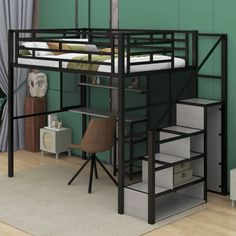 a loft bed with stairs and desk in the corner, next to a green wall