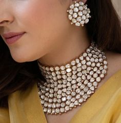 This Uncut Polki Diamond choker set comes with gold plated finish and a beautiful sabyasachi inspired look. The set can be paired as desired and can be worn separately as well. The perfect jewelry for reception, weddings, sangeet, pithi/haldi, engagements or a fun night out for a statement look! Product Details: * Choker * Stud Earrings This is the actual product picture so no surprises (please note colors may vary slightly due to image resolution etc)   NOTE - Please Reach out to me for availability and shipping times. This set is available for preorder. If the set is available to ship I will ship, but if not then it will take 2-3 weeks for shipping. Please check availability BEFORE placing order.  To see more beautiful and unique pieces, please check out my shop: https://www.etsy.com/sho Sabyasachi Bride Jewellery, Heavy Gold Necklaces For Reception, Heavy Gold Jewelry For Reception, Gold Choker For Diwali Reception, Gold Choker For Reception And Diwali, Gold Kundan Necklace With Jewels, Gold Cutdana Jewelry Sets For Reception, Gold Kundan Necklace With Cutdana For Reception, Gold Chandbali Jewelry With Jewels