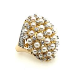 A Magnificent 14k gold cocktail ring set with 18 colorless VS natural baguette diamonds weighing approximately 1 carat and 38 natural round brilliant colorless VS diamonds weighing approximately 1.52 carats.   Total weight for the diamonds are approximately 2.52 carats. The 37 pearls range from 3-4.5mm. The ring is a size 7.25 plus and weighs 31.3 grams total. This was part of a set, please visit the online store for the matching pendant/pin set with less diamonds. Pearl And Diamond Cocktail Rings, Pearl Cocktail Ring, Gold Cocktail Ring, Colorless Diamond, Pearl Collection, Vs Diamond, Gold Necklace Designs, Baguette Diamond, Cocktail Rings