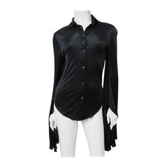 A fabulous black fine stretch silk shirt, top, blouse from Tom Ford for Gucci. It is semi fitted with a shirt collar, black mother of pearl Gucci inscribed button up the front and great long draping angel sleeves. Fit sizes Extra Small, Small. Marked Italian size 38. Bust 35" Sleeves 36" Length 26" Luxury Gucci Blouse For Office, Gucci Formal Button-up Shirt, Black Gucci Winter Top, Elegant Gucci Blouse For Evening, Gucci Black Tops For Spring, Elegant Gucci Blouse For Party, Elegant Gucci Party Blouse, Gucci Long Sleeve Evening Tops, Gucci Evening Long Sleeve Tops