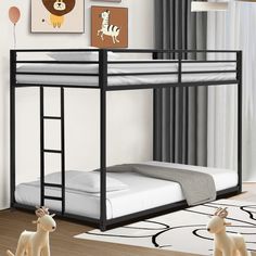 there is a bunk bed with a ladder on the bottom and an animal figurine next to it