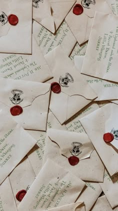 many old envelopes are piled on top of each other with red wax stamping