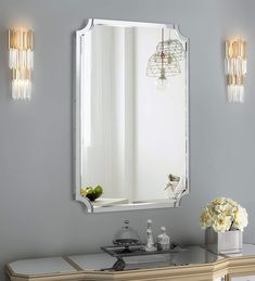 a bathroom with a vanity, mirror and lights