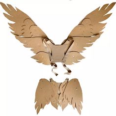 an image of two birds made out of cardboards on white background, one with wings and the other without wings